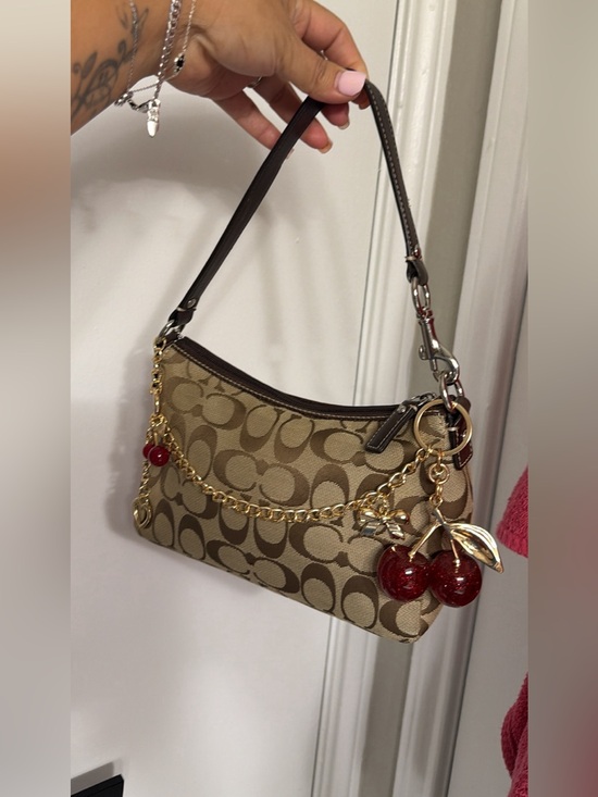 Coach Handbags - Coach Tan Signature Canvas Shoulder Bag with Red Cherry Charm